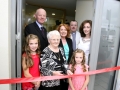 Cutting the tape to officially open the New Blackpool Bridge Surgery were, Long time Blackpool Native Peggy Manning ablely assisted by Chloe and Ciar Vaughan, also in Picture, Dr. John Sheehan, Minister Kathleen Lynch T.D..Fr. Damian O'Mahony and Dr. Antoinette Morission. Picture, Tony O'Connell Photography.